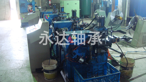 Automatic shell rolling machine